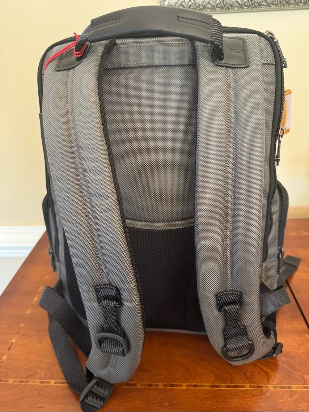 Tumi Gray Parrish Backpack with Black Trim and Tan Leather Tag